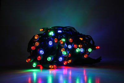 Outdoor LED Lighted Christmas Tree with Green Base and Red and White Tree Lights