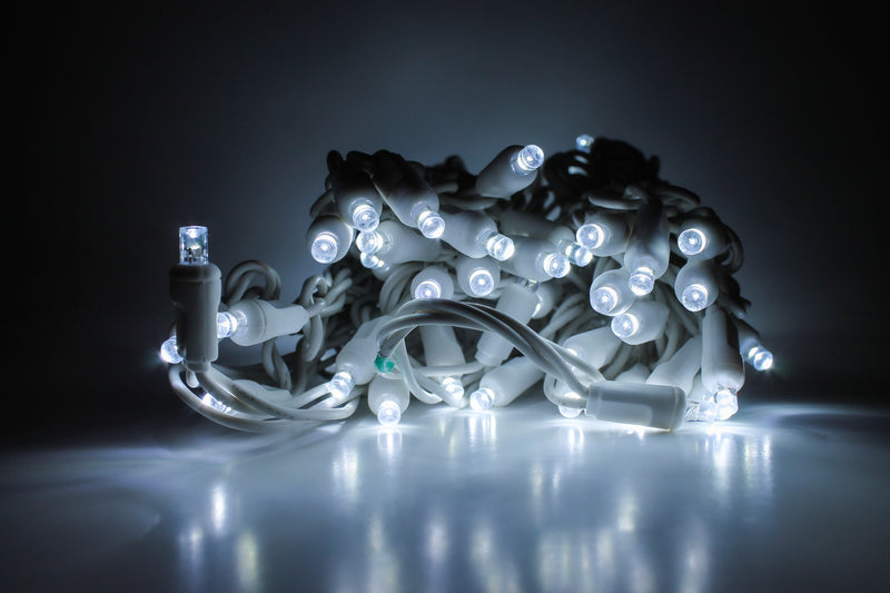 Outdoor LED Lighted Christmas Tree with a White Base and Green Tree Lights